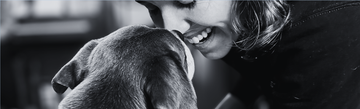 Leah Cole with a dog during a session